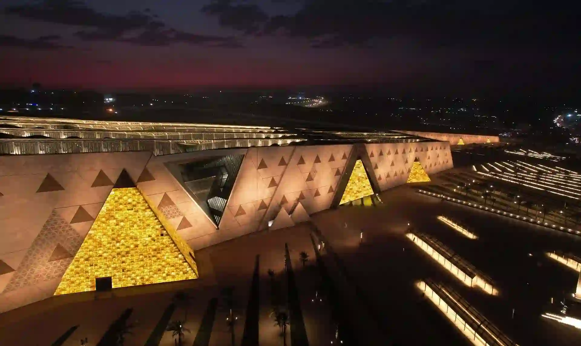 Grand Egyptian Museum near Giza Pyramids showcasing modern architecture and ancient Egyptian artifacts