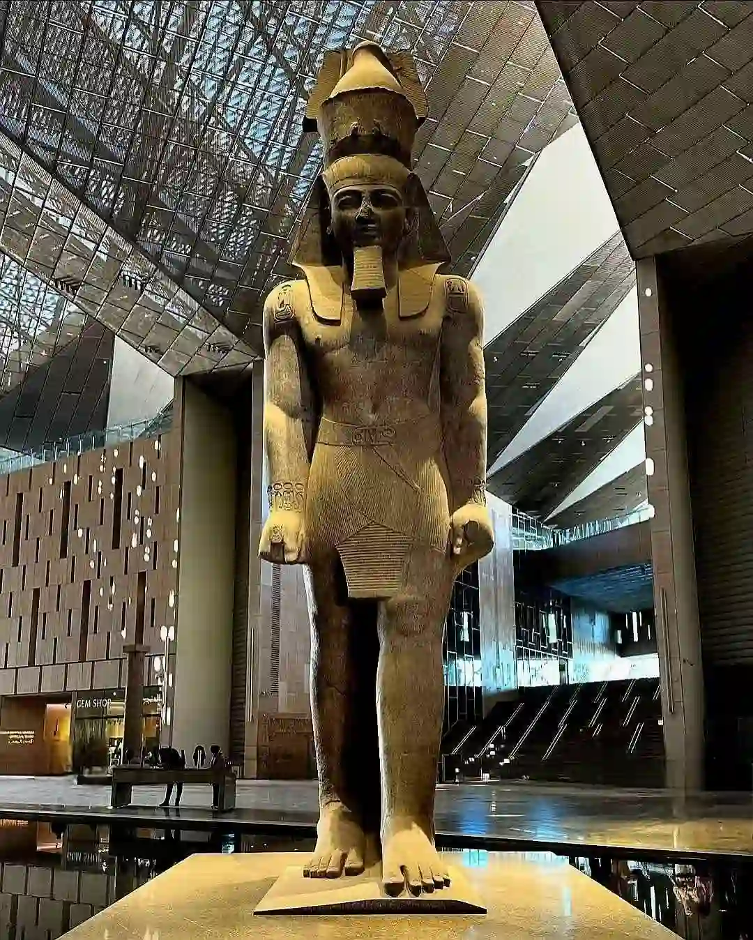 Grand Egyptian Museum near Giza Pyramids showcasing modern architecture and ancient Egyptian artifacts