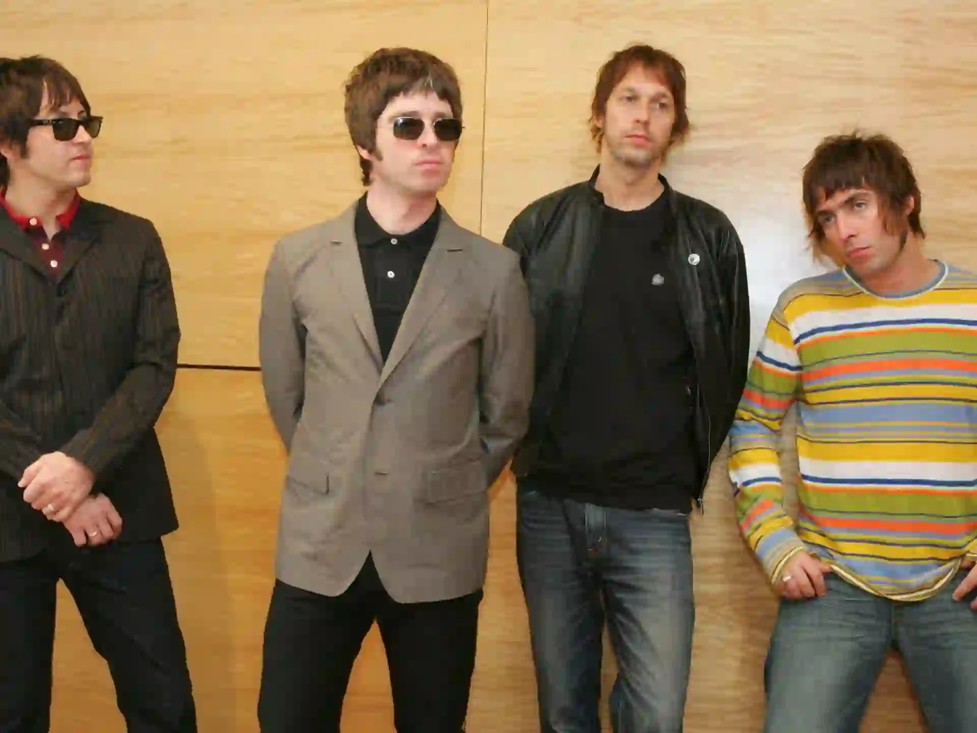 “Oasis band members Liam and Noel Gallagher during a live performance”