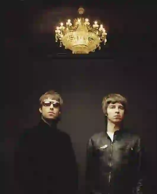 “Oasis band members Liam and Noel Gallagher during a live performance”