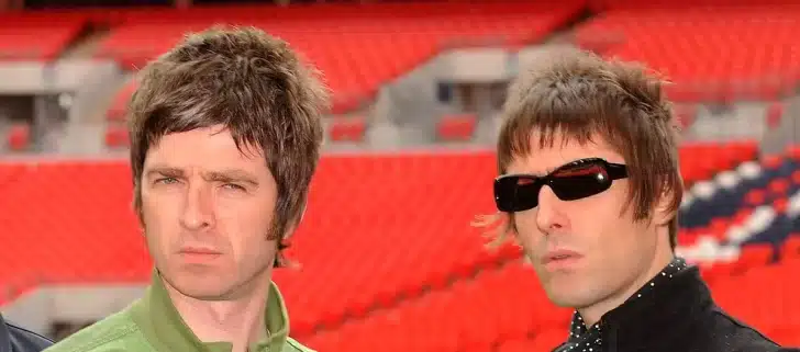 “Oasis band members Liam and Noel Gallagher during a live performance”