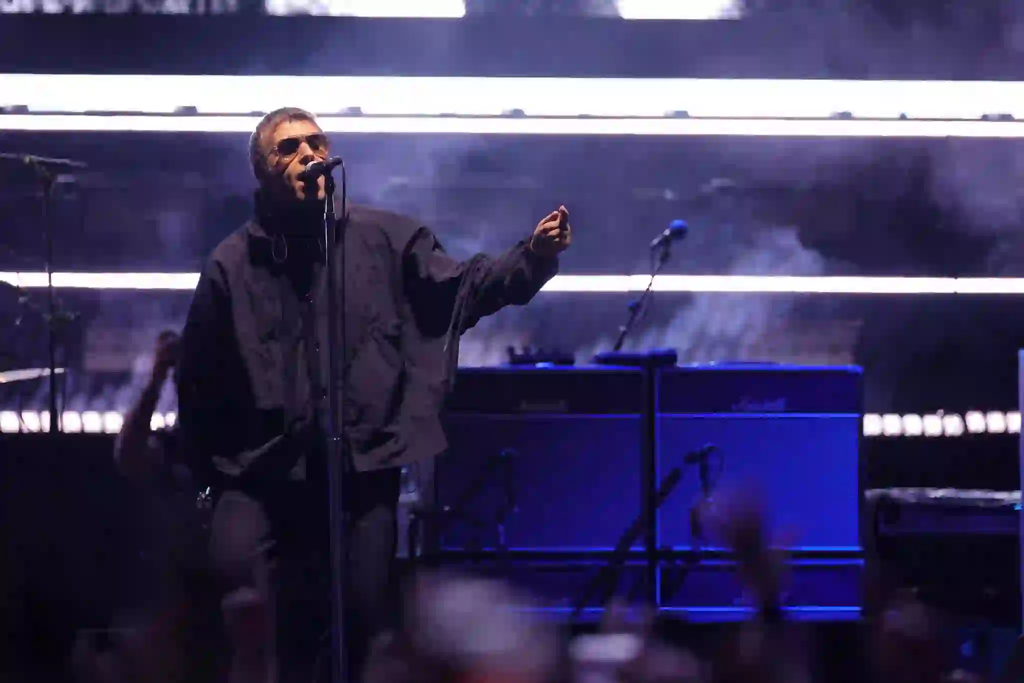 “Oasis band members Liam and Noel Gallagher during a live performance”